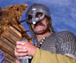 Man dressed as a Viking holding a sword