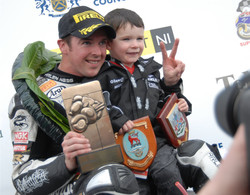 Thumbnail image for Alastair Seeley celbrates his second win at the 2010 North West 200 with his son