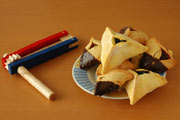 Wooden rattle and triangular cookies. Image © Howard Sandler/iStockphoto.com