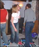 Action at a dance mat party 