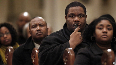 A Boston man listens during a meeting held to update family members about their relatives in Haiti