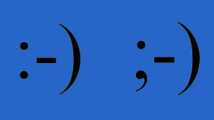 A smiley emoticon and a winking emoticon