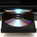 A disc sliding into a DVD player