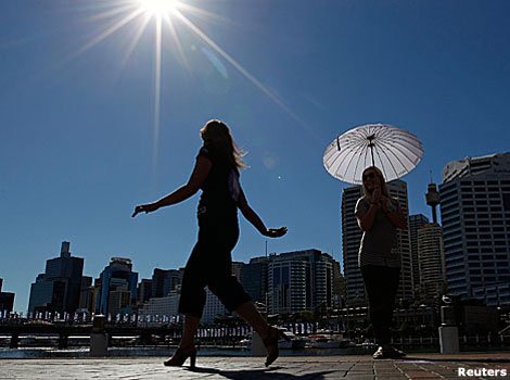 A model walks along an outdoor catwalk in the sunshine in Sydney, Australia.