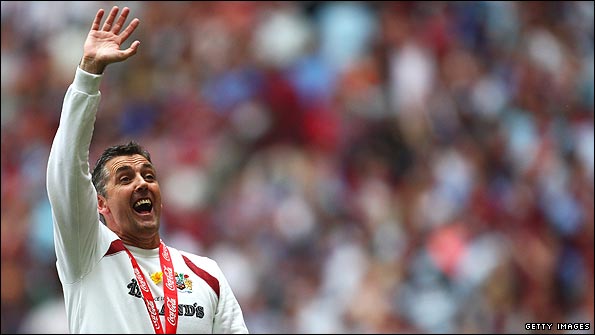 Owen Coyle celebrates winning promotion to the English Premier League
