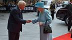 A man bowing to the Queen
