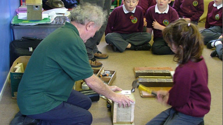 A team from the Gwent Wildlife Trust show local schoolchildren how to make a bird box