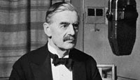 Neville Chamberlain conducts a radio broadcast on the BBC