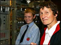 Linda Brackenbury shows Baby to a school pupil