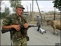 Russian soldier and local man in South Ossetia