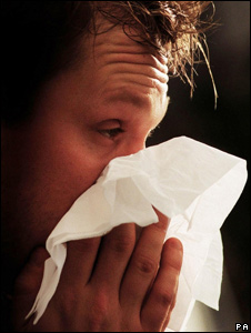 A man blowing his nose