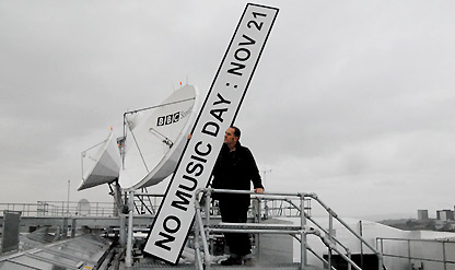 Bill Drummond and the No Music Day logo on top of BBC Scotland in Glasgow