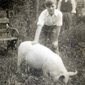 A 10 year old Maurice and his pet pig from the story - Betsy – circa 1949