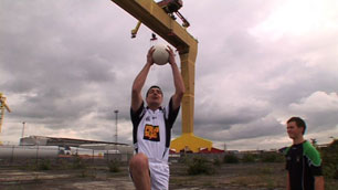 Footballer doing the high catch at Titanic Quarter