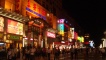A Beijing street lit up at night.