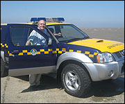 Ray with coastguard car