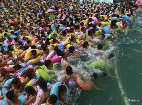 Visitors are packed like sardines in a pool at a tourist resort in Sichuan province. 