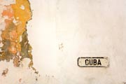 Decaying painted wall with a sign reading 'Cuba'. © Tim Lecomte/iStockphoto