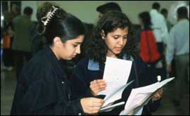 Pupils studying exam results