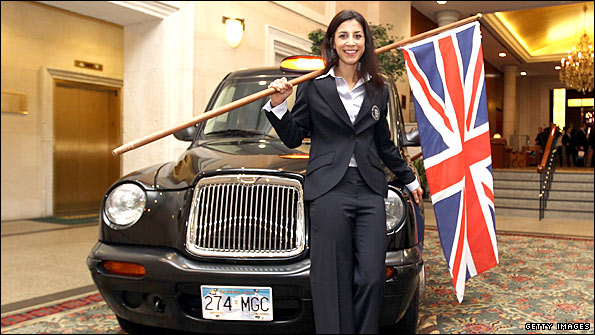 Shelley Rudman poses with a London taxi