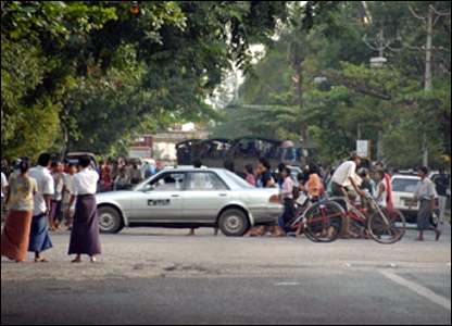 Protesters and army trucks in Rangoon.