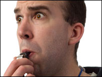 A man blowing a whistle