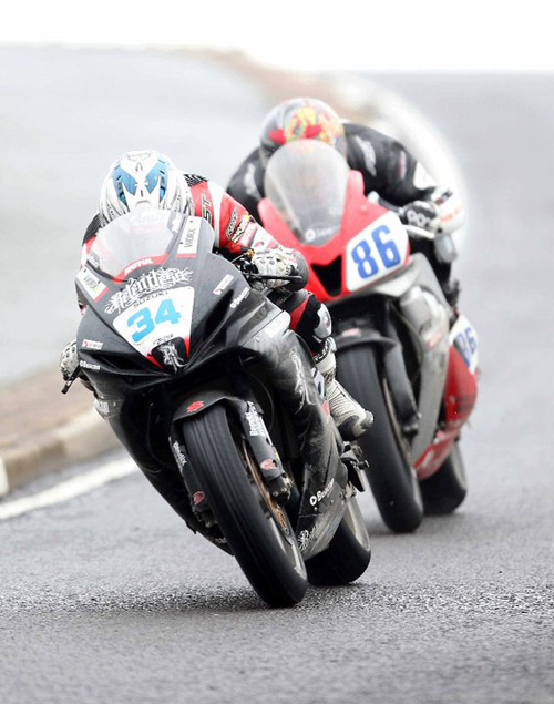 Alastair Seeley and Cameron Donald battle it out in the Supersport race
