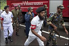 Soldiers of Pakistan Armed Forces rush to the site of a plane crash in Islamabad,