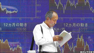 Man stands in front of an electronic board