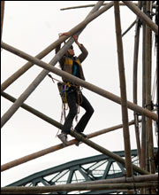 Bamboo bridge under construction by River Tyne