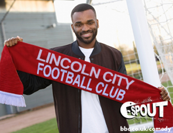 Darren Bent holding a Lincoln City FC scarf.