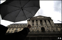 A person holds an umbrella over the Bank of England in London. Tim Ireland/PA Wire