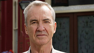 Larry Lamb as Archie Mitchell