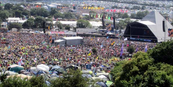 Somewhere in the crowd, the BBC's Mark Radcliffe is singing along to every word of Willie Nelson's set