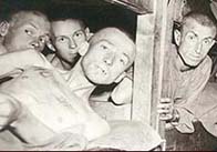 Photograph showing concentration camp prisoners in their hut