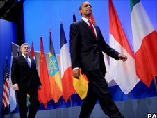 Gordon Brown walking behind Barack Obama