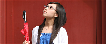 A woman wondering if it will rain