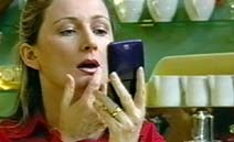 Scarlett checks her lippie