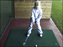 Child playing golf