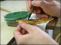 Applying enamel to a base metal car plate