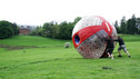 Greg James rolls down a hill in a massive ball!!