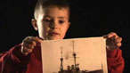 A child with an image of ship from World War One