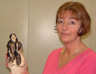 Liz Hinds holding the Indian doll she believed her father bought for her