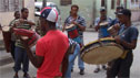 Men playing drums in a street