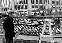 The ribs of a skeleton boat are examined before the outer planking is applied