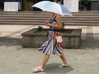 Another Chongqing woman with an umbrella.