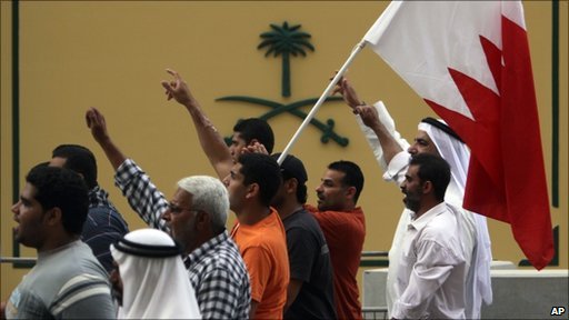 Photo showing protesters in Bahrain waving a flag