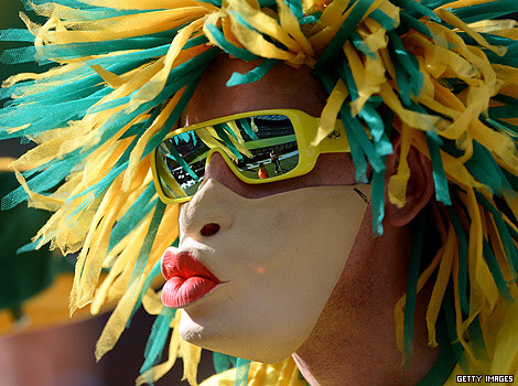 A Brazilian football fan wearing a mask