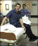 Nick Lawrence on a hospital bed