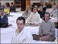 People meditating